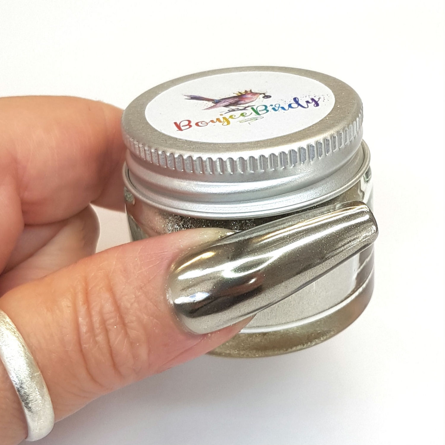 Close-up of a nail featuring Boujee Birdy E.J silver chrome powder with an ultra-shiny metallic finish.