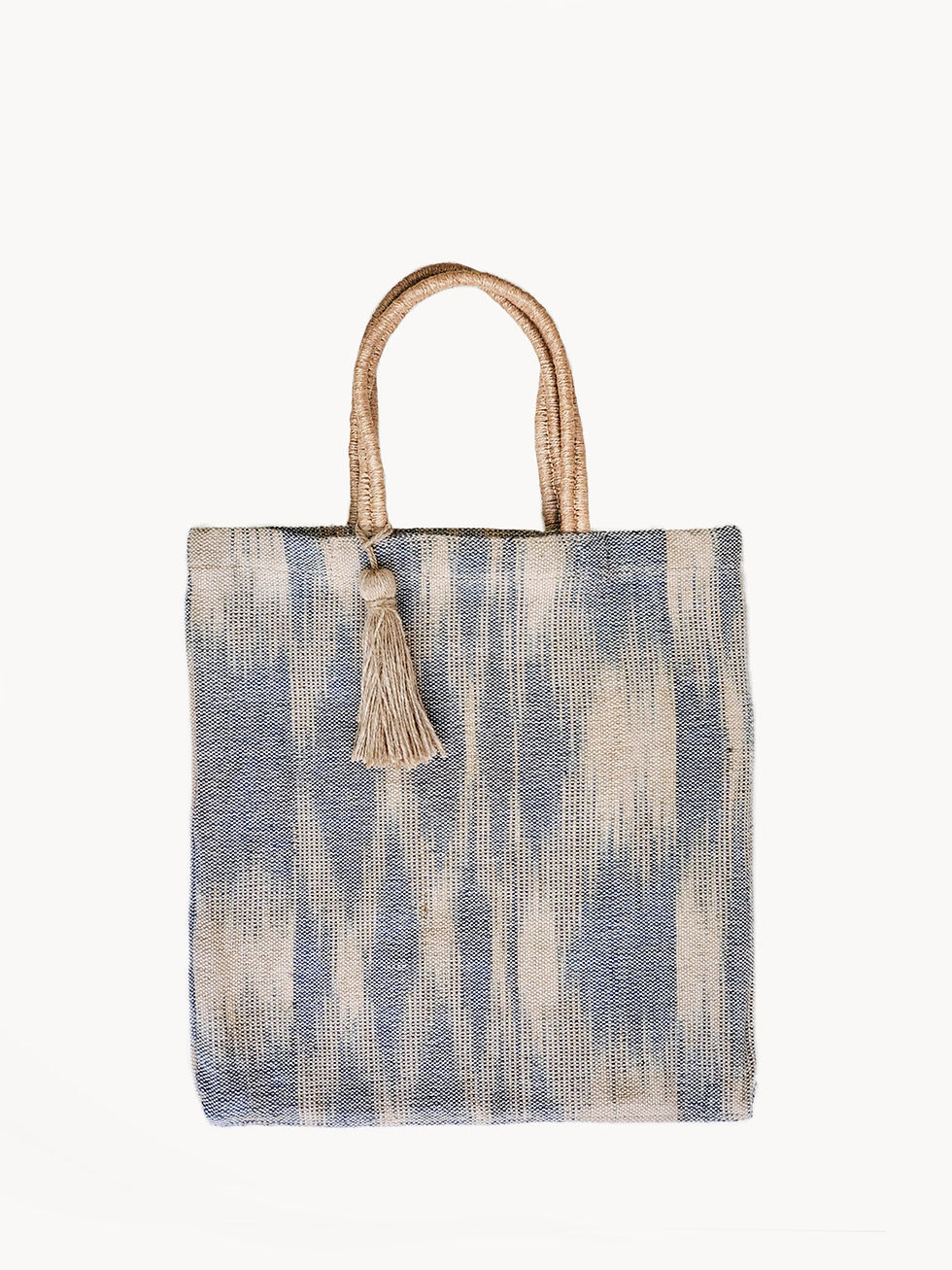 Blue and white patterned tote bag with handles and tassel