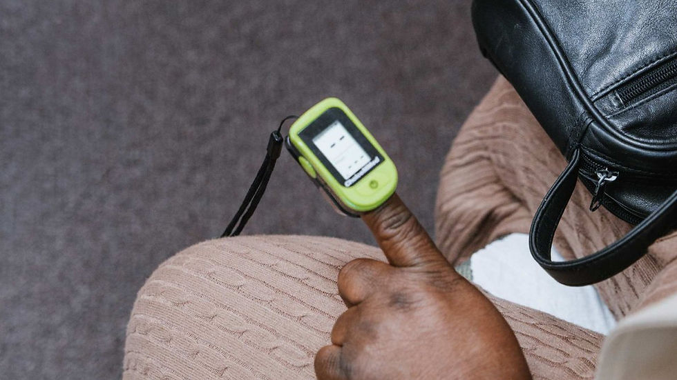 Patient using a pulse oximeter during a medical visit for evaluation of dizziness and related symptoms.