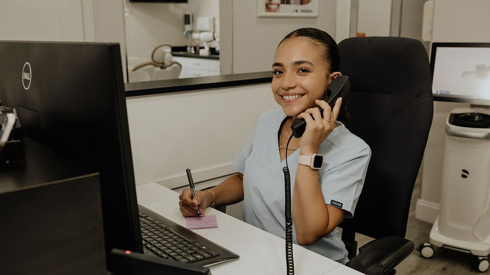 Friendly dental team member welcoming new patients at a modern dental office in Norwalk, CT.
