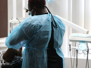 Dental hygienist performing a deep cleaning procedure for gum disease treatment at Avalon Dental Center Cambridge.