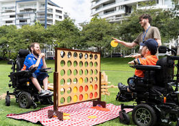 2-wheelchair-users-playing-Connect-4-first2care-ndis-plan-support-australia