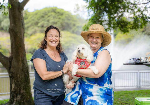 women-holding-dog-first2care-ndis-plan-support-australia