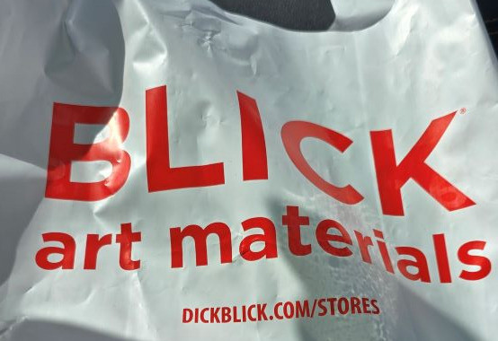 image: white plastic shopping back with Blick logo