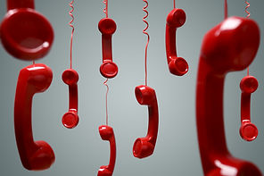 Red telephone receiver hanging over gray background concept for on the phone, on hold or c