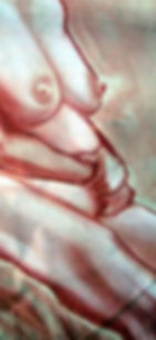 Eye-level view of an artist sketching a seated model in a studio setting