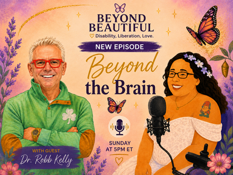Illustrated promotional graphic for the Beyond Beautiful podcast episode titled “Beyond the Brain.” The image features a soft peach, pink, and purple watercolor background with floral accents, butterflies, and gold sparkles. On the left is a cartoon illustration of guest Dr. Robb Kelly wearing a green pullover and red glasses, smiling with his arms crossed. On the right is a cartoon illustration of host Mandi seated in her wheelchair, wearing a white dress with purple flowers in her hair and speaking into a microphone. Text reads: “Beyond Beautiful: Disability, Liberation, Love,” “New Episode,” “Beyond the Brain,” “With Guest Dr. Robb Kelly,” and “Sunday at 5 PM ET.”