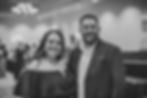 Female Auction Group owner with her husband at an event in black and white