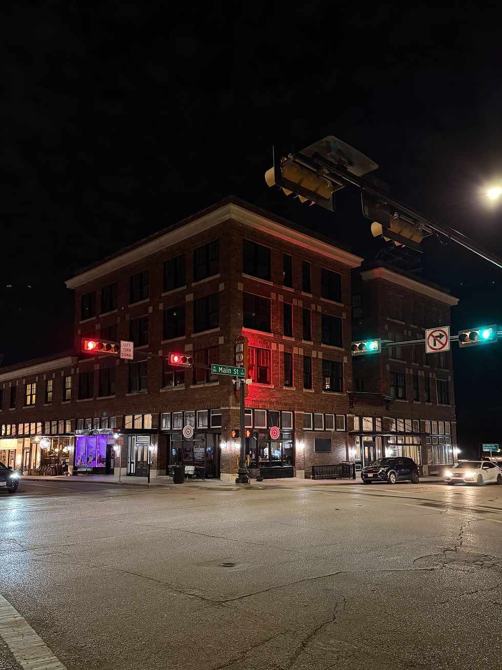 A corner view of the Rogers Hotel at night