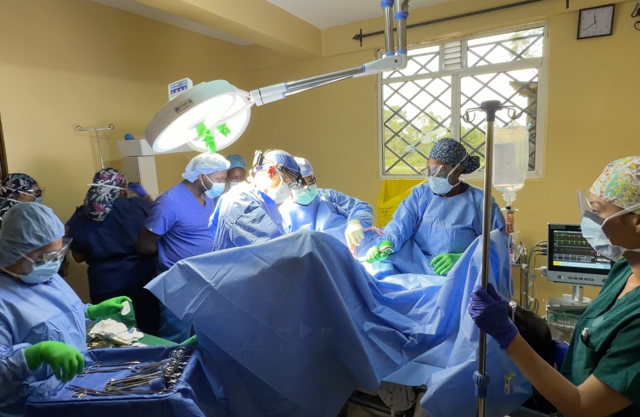 Surgical team performing a procedure in an operating room