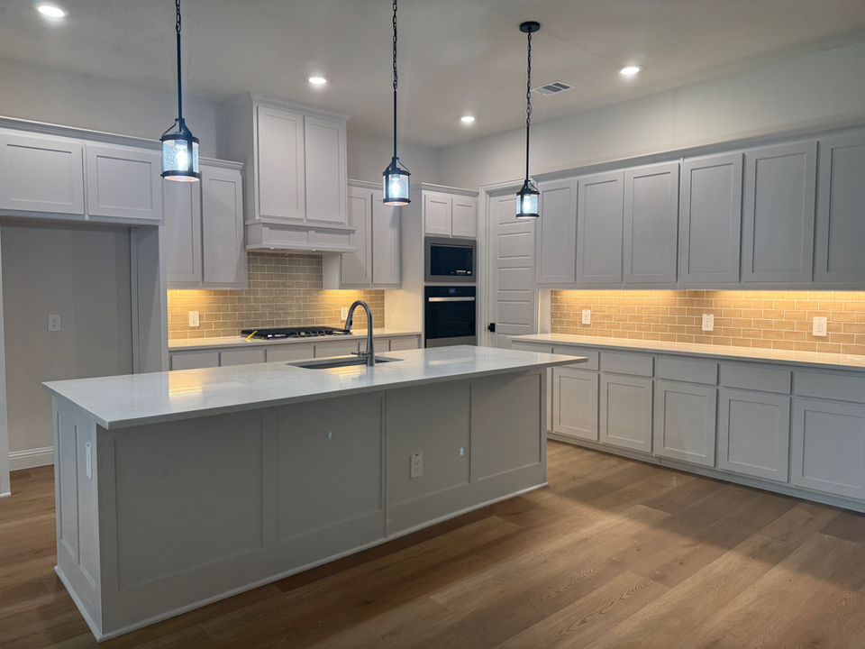All white custom kitchen with island and custom cabinets