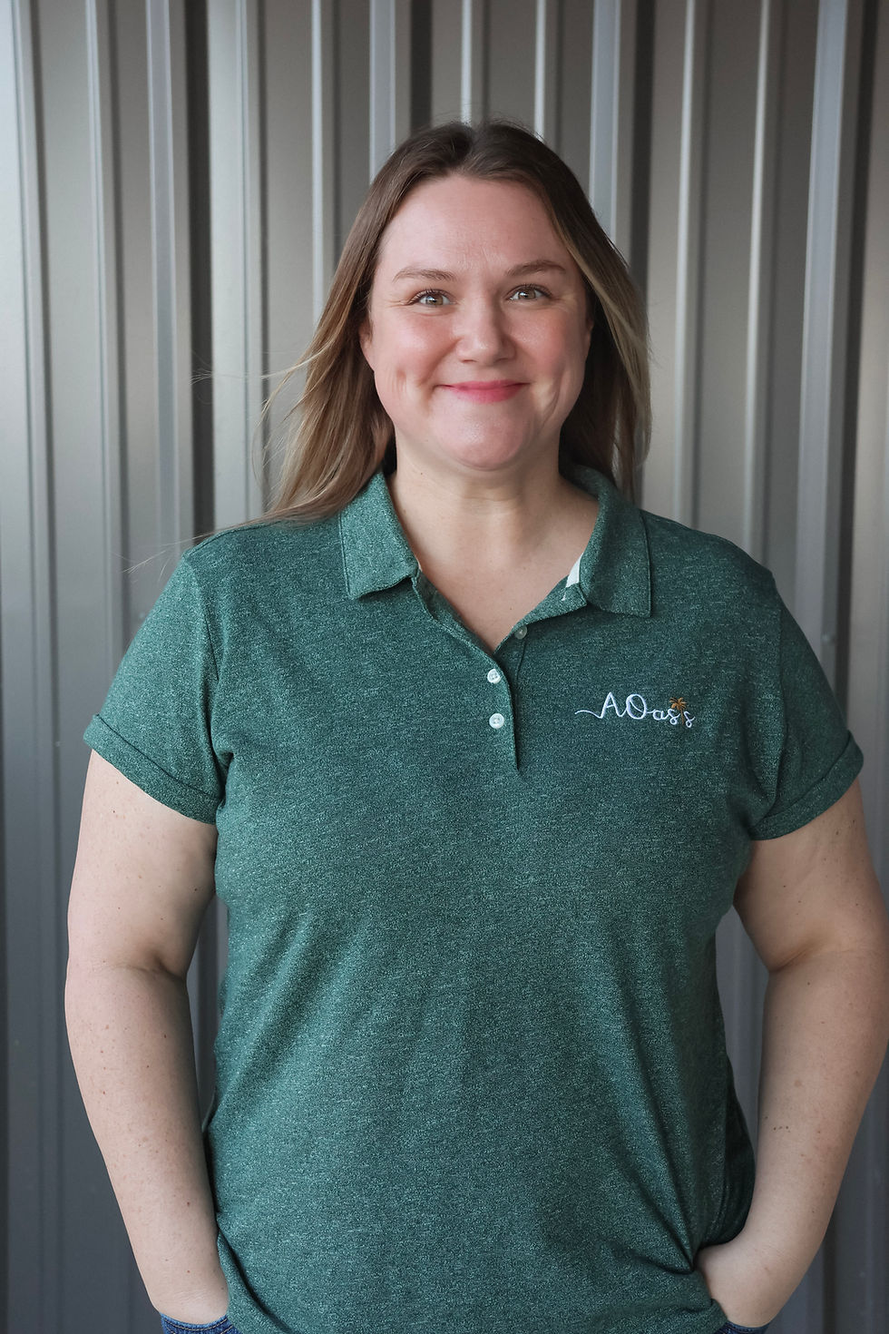 Photo of smiling woman in work polo