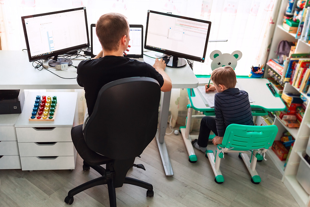 dad and child working side by side