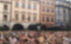 The town square is packed with hundreds of people waiting for the famous Prague clock to strike.