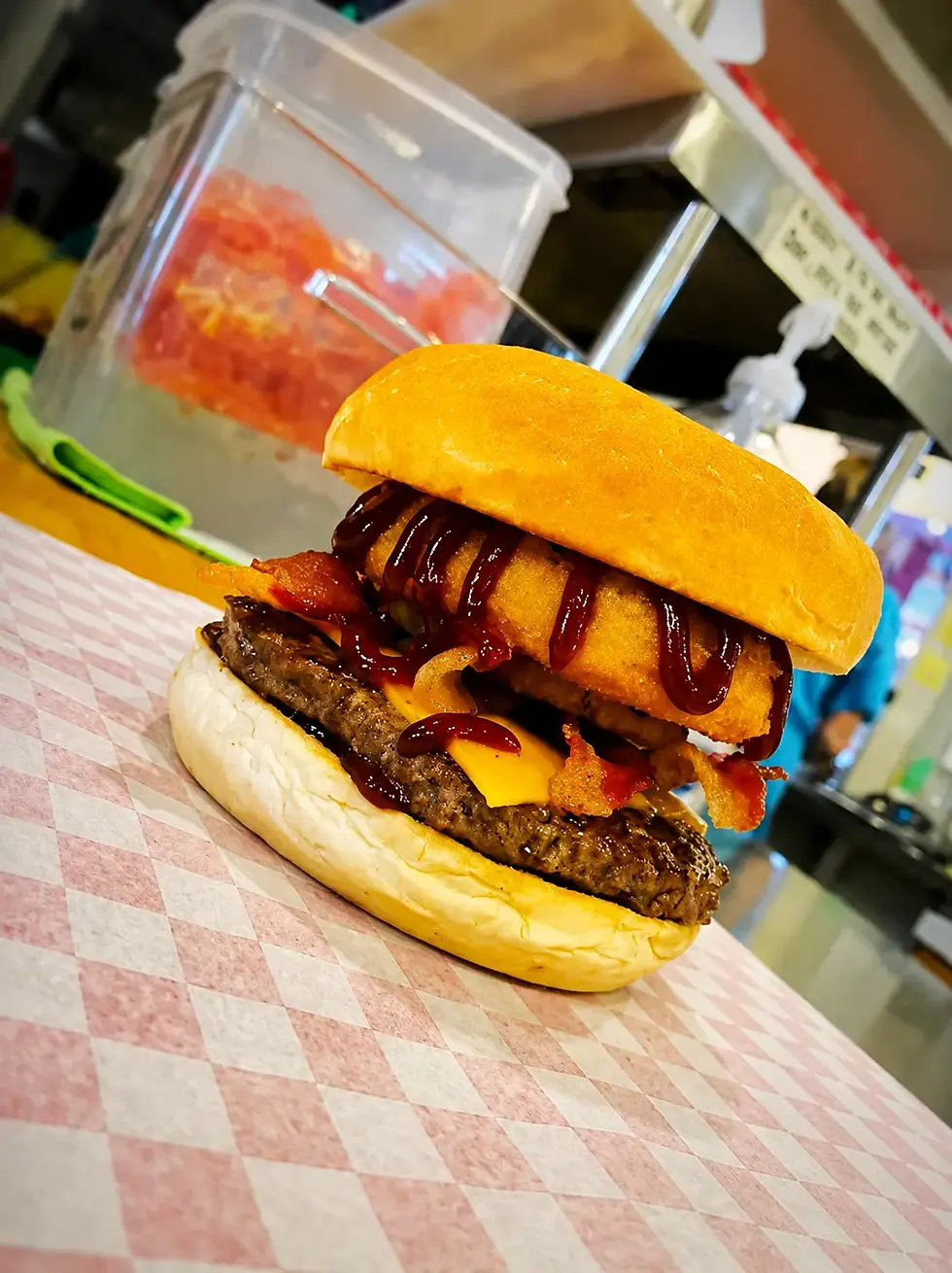 the-hill-burger-with-onion-ring.webp
