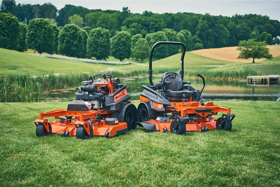 Bad Boy zero turn mowers sitting on fresh cut grass.