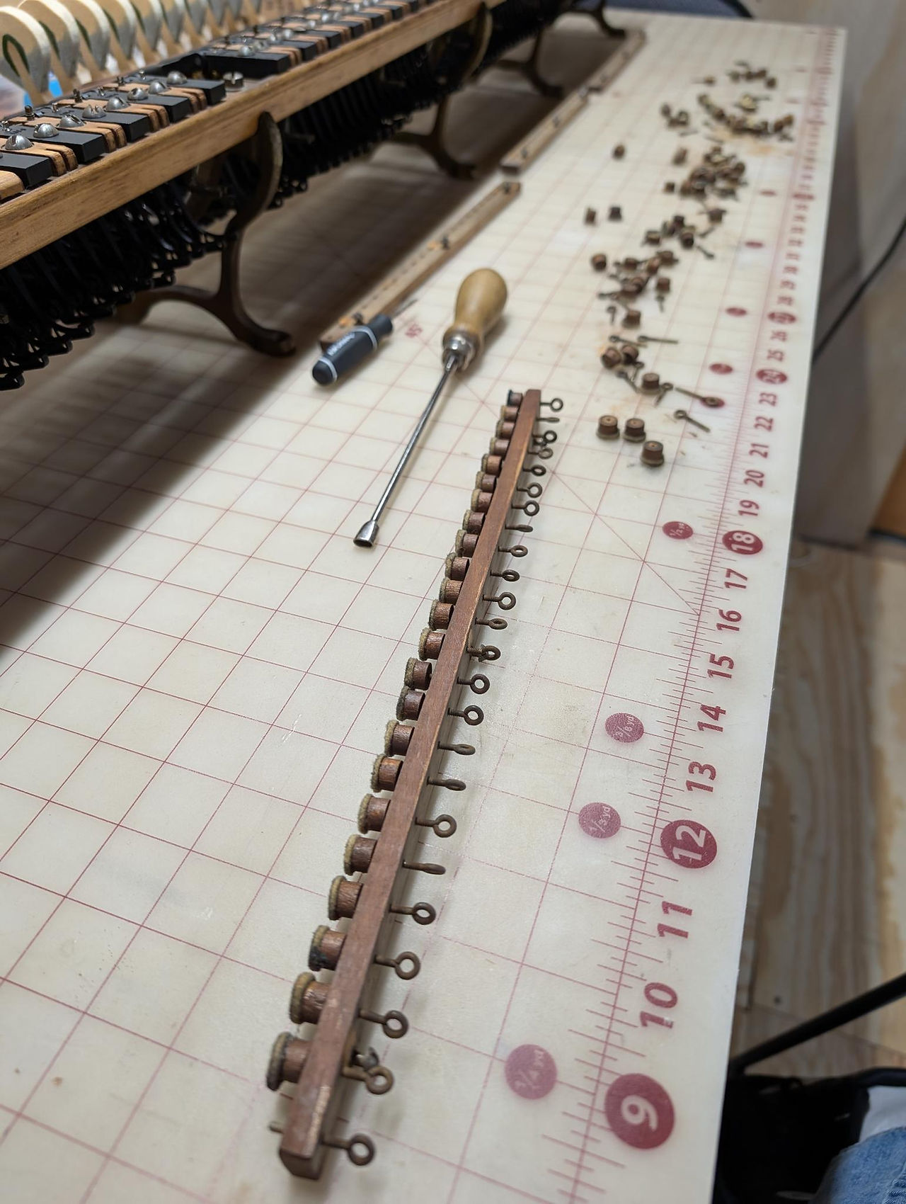 Worn out grand piano let-off buttons