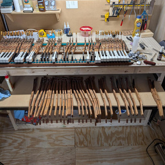 A workshop with grand piano keys