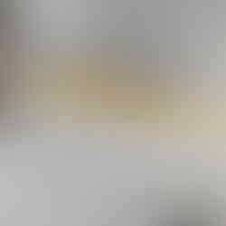 A key that is having extra glue being placed on the outside as a brace