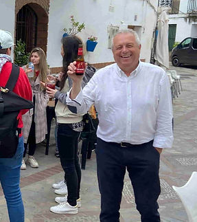 Mayor Cheering with a Beer at Rooral Coliving Village Festivities