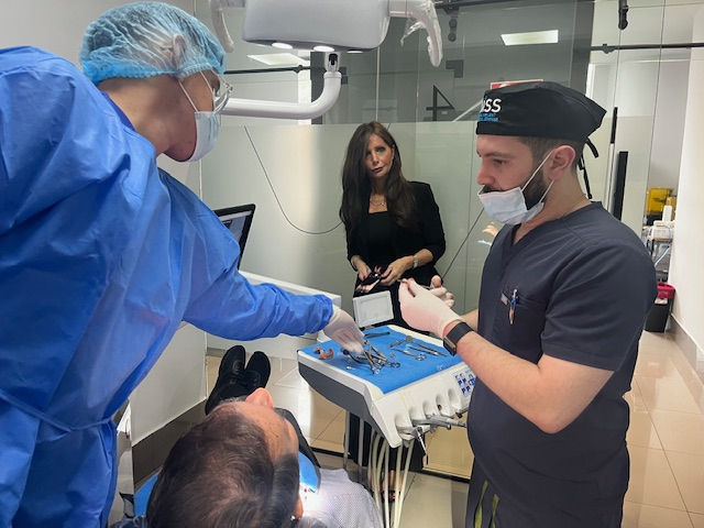 Eye-level view of a dental implant surgical setup with instruments