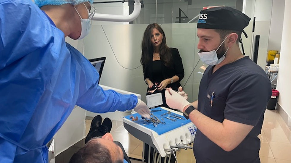 Eye-level view of a dental implant surgical setup with instruments