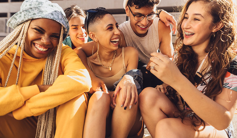 Ethnically diverse group of teenagers laughing