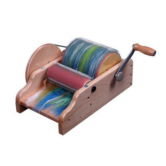 An wooden Ashford Drum Carder on a white background