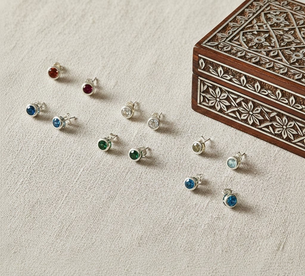 Silver stud earrings with gemstones, lifestyle image