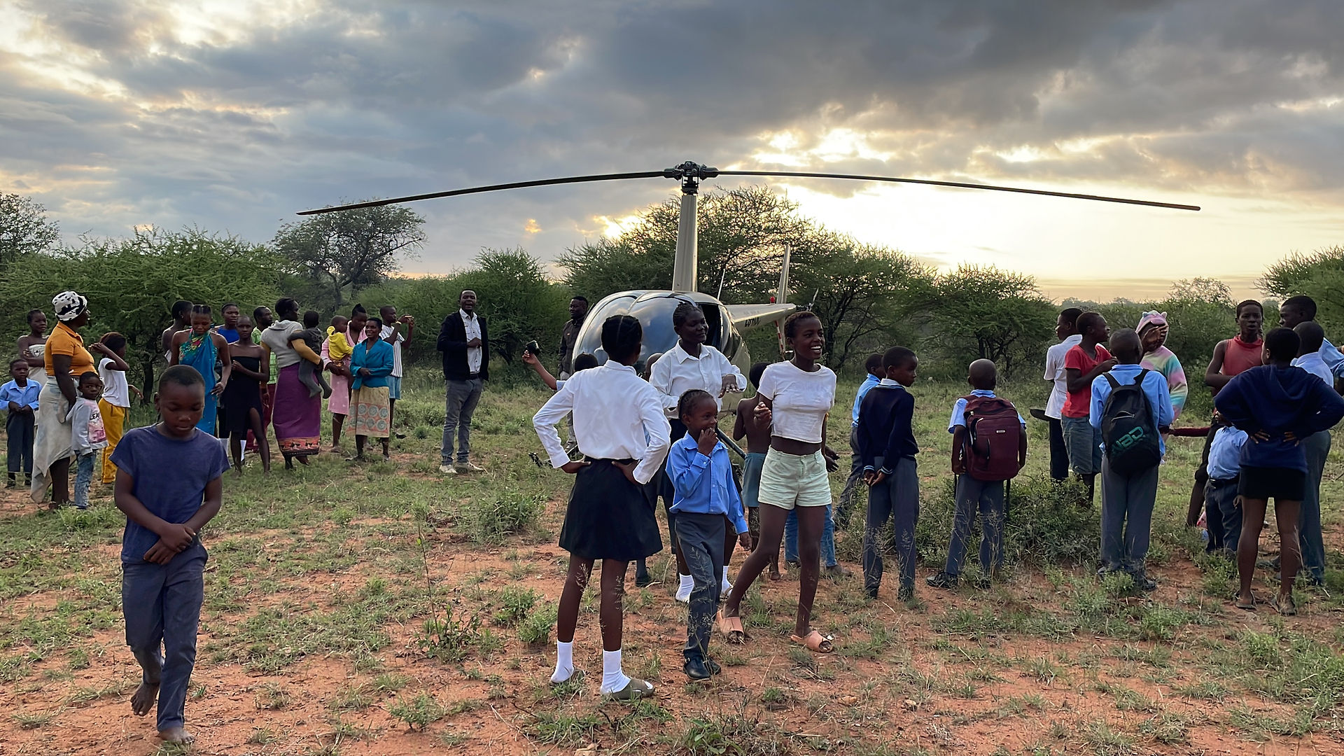 helicopter with village members bordering kruger national park