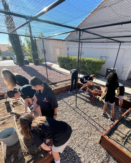 Happy students enjoying their planters built by Living Water Home and Garden as a community service project