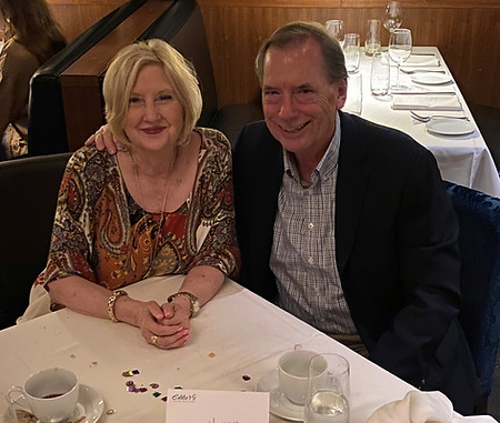 Bob and Vicki Fox sitting at a restaurant table