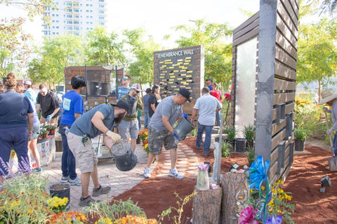 Living Water Lawn and Garden staff working hard to install the water feature and travertine heart memorial pieces.
