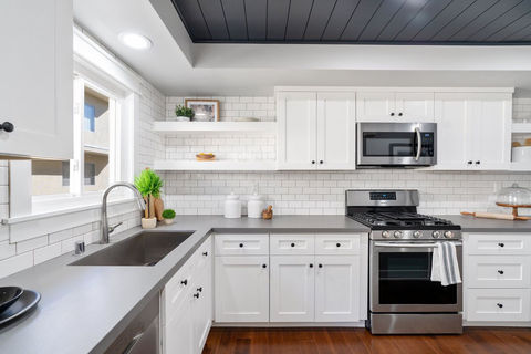 Zuno kitchen cabinet refinished in white.jpeg