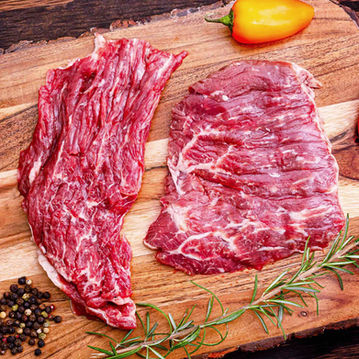 carne asada steak on a cutting board