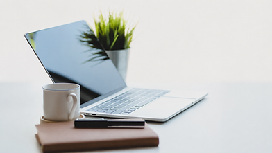 laptop note book and coffee cup on desk