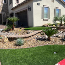 Desert landscape design featuring artificial turf and drought-tolerant plants