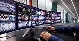 Computer Operator Monitoring CCTV Footage For Advanced Security System.jpg