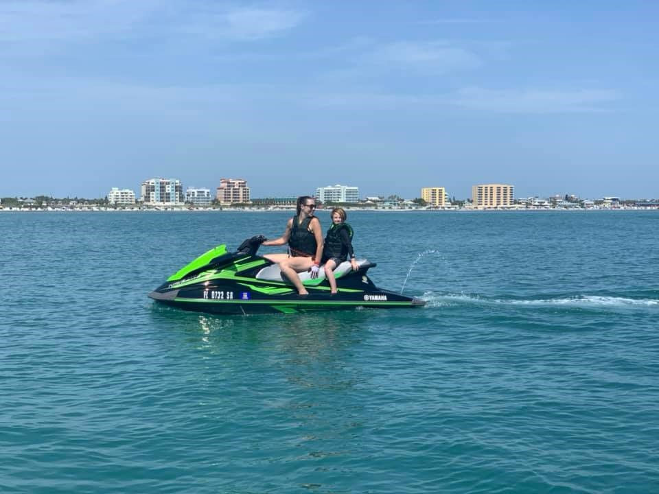 Tara Kling on a personal watercraft in ocean through Ponce Inlet