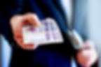 Man handing Norwegian bank notes - The NOK
