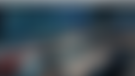 Professionals overseeing multiple system dashboards in a control room