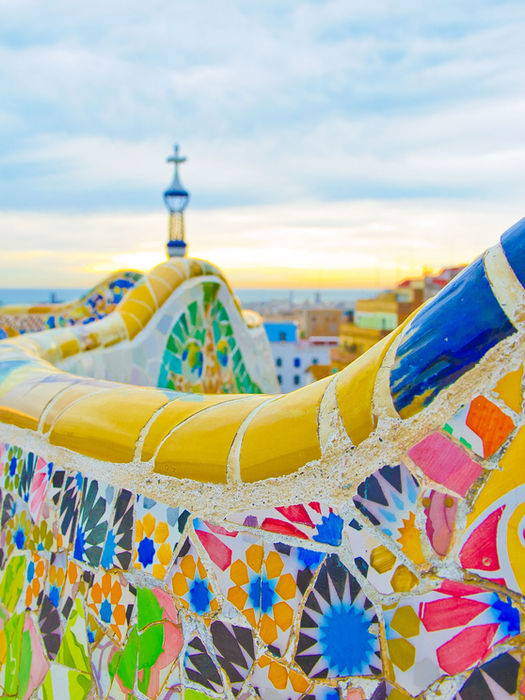 Colorful mosaic bench designed by Gaudí in Park Güell, Barcelona