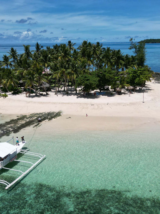 Tropical island and boats in the Philippines