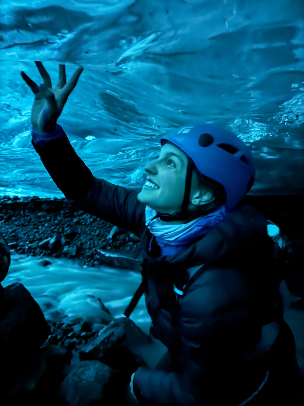 Solo traveler experiencing blue ice caves in Iceland with FTLO