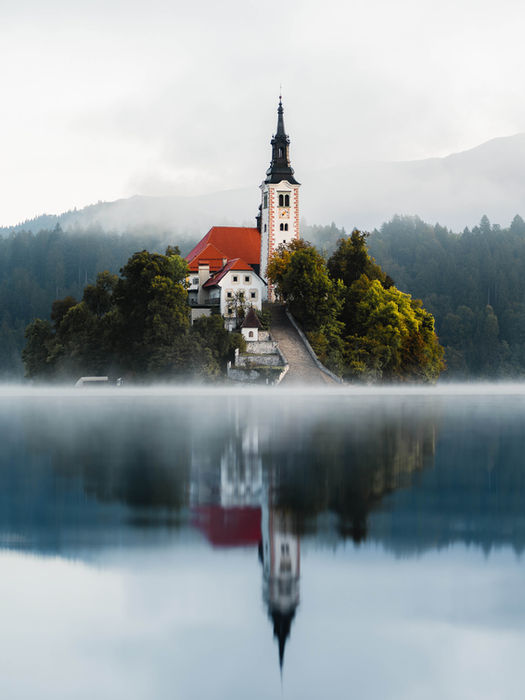 Lake Bled with its island church and fog-covered water