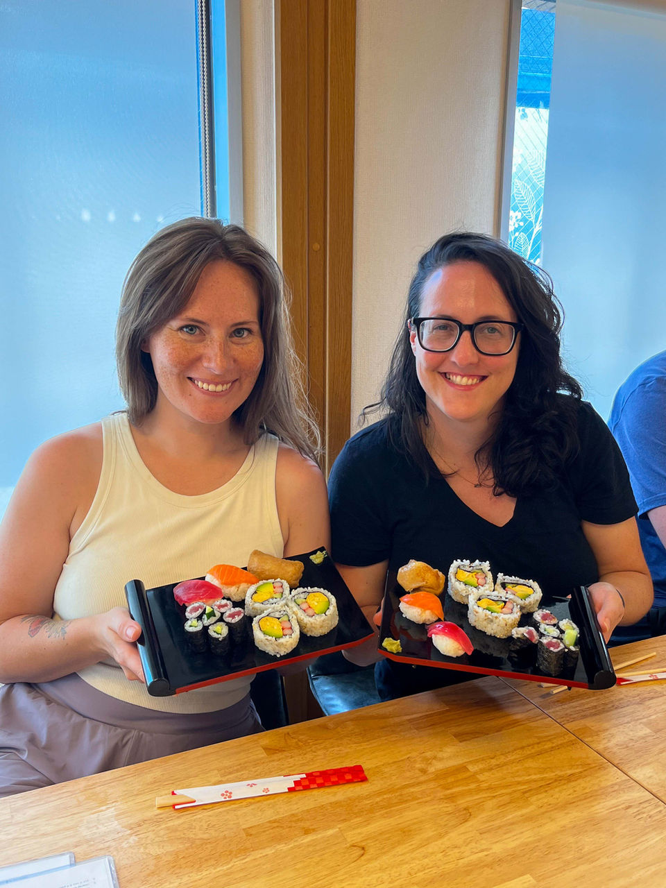 FTLO travelers making sushi rolls during a Japanese cooking class in Kyoto.