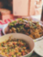 Traditional Jordanian dishes with rice, vegetables, and meat served on a table