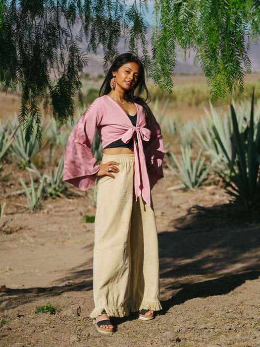 female traveler standing in agave fields