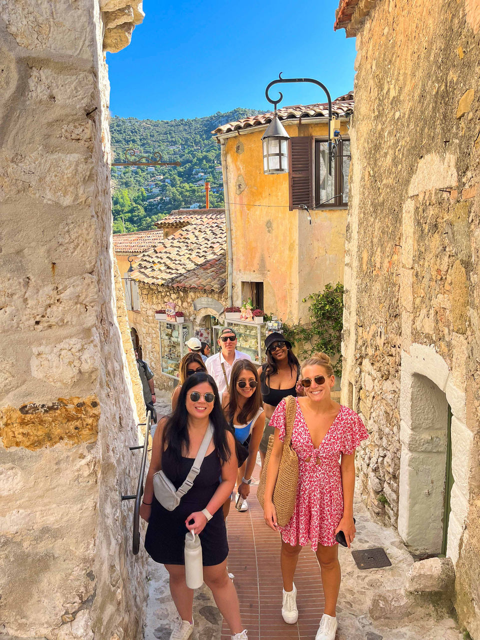 FTLO Travel group exploring cobblestone streets in a medieval village in the South of France