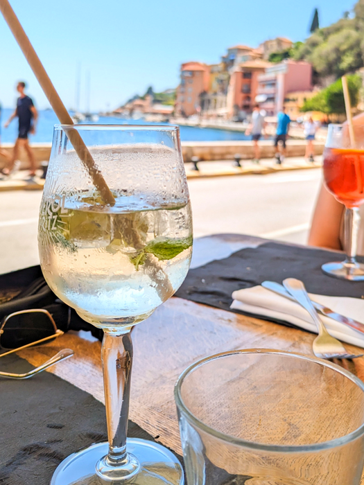 Drinks on a sunny café table by the water in Villefranche-sur-Mer